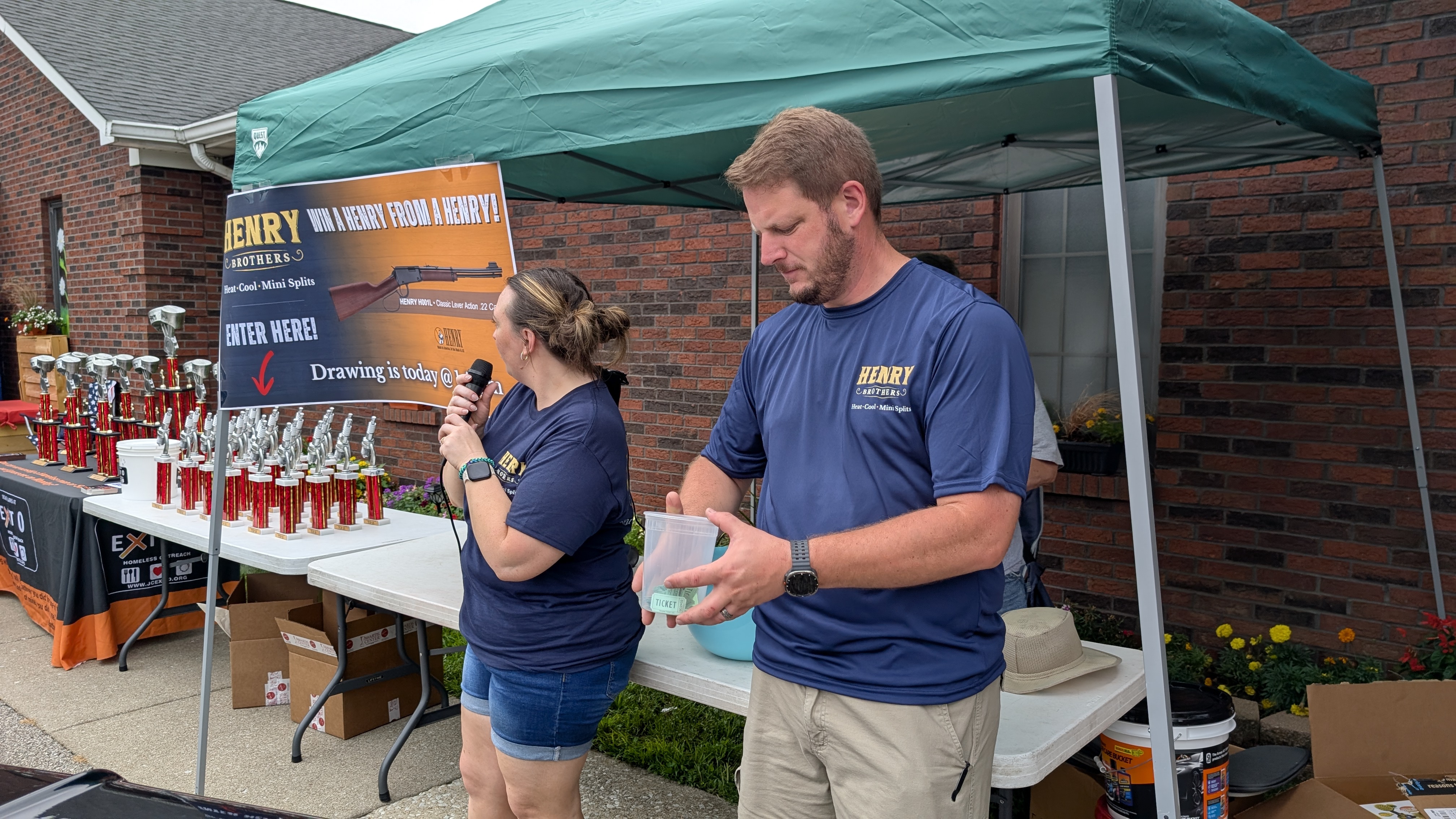 Henry Brothers mini-split team running raffle drawing at Jeffersonville Indiana community event
