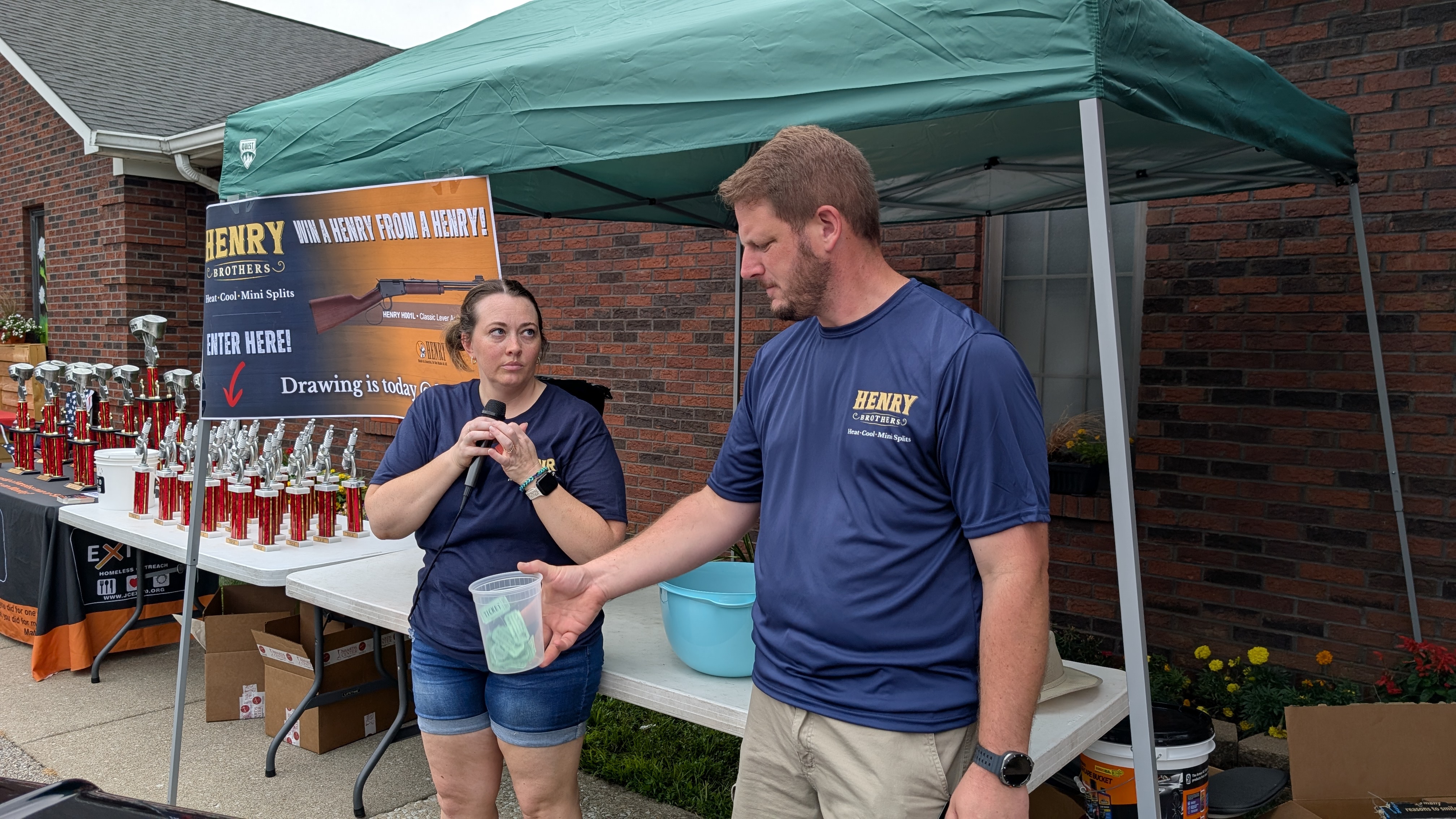 Henry Brothers owners Nick and team member conducting raffle at Jeffersonville Indiana event booth