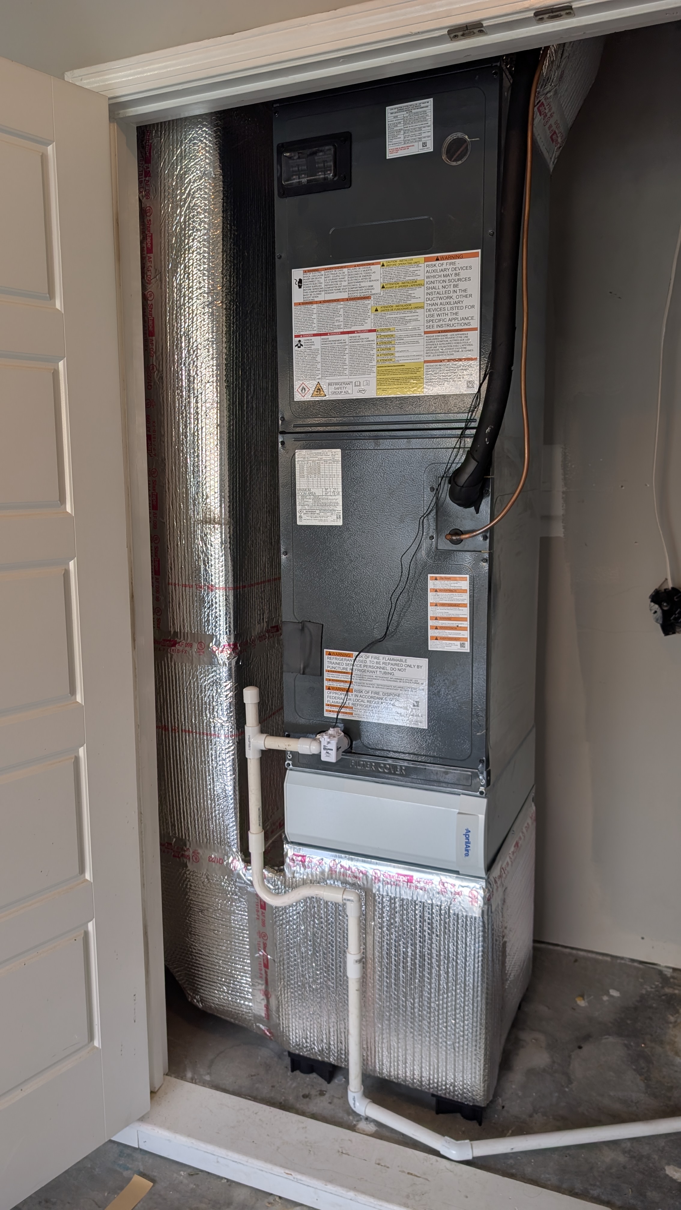 Completed air handler and evaporator coil install with insulated flex duct in a Clark County Indiana garage closet