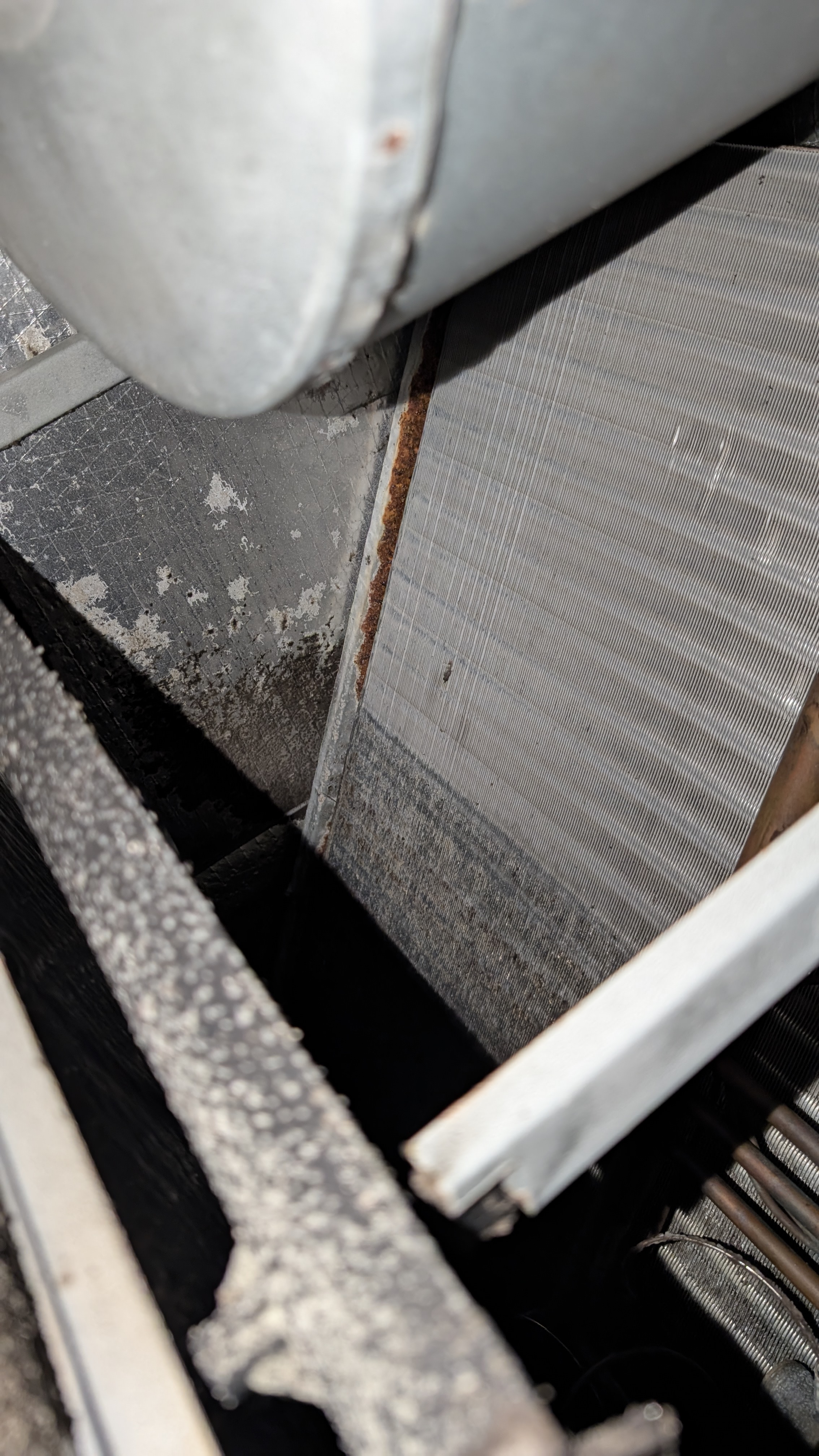 Rust along the coil edge and heavy grime on the evaporator fins in the old air handler, Memphis Indiana inspection