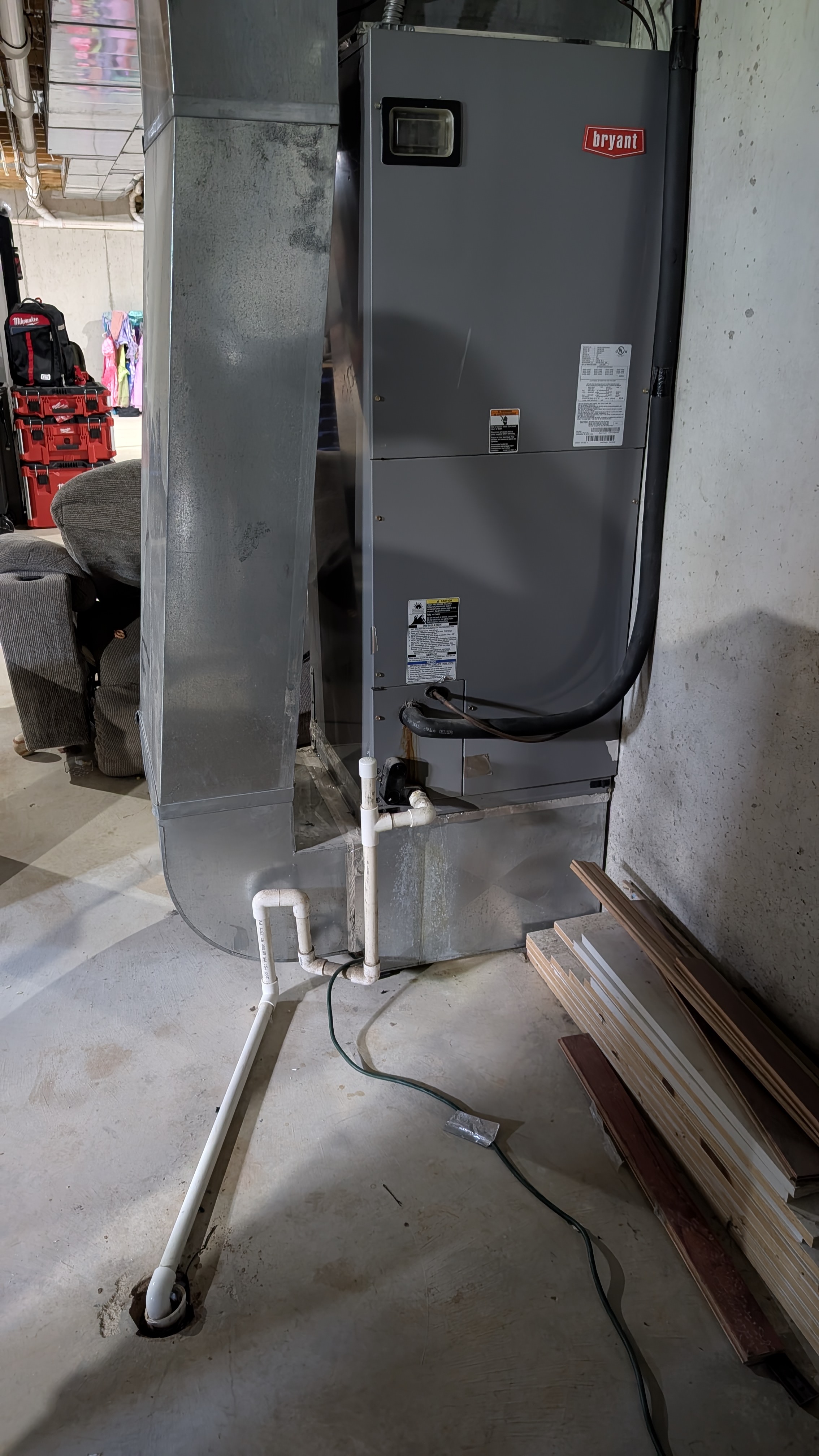 Full view of Bryant air handler with ductwork and condensate drain Memphis Indiana basement
