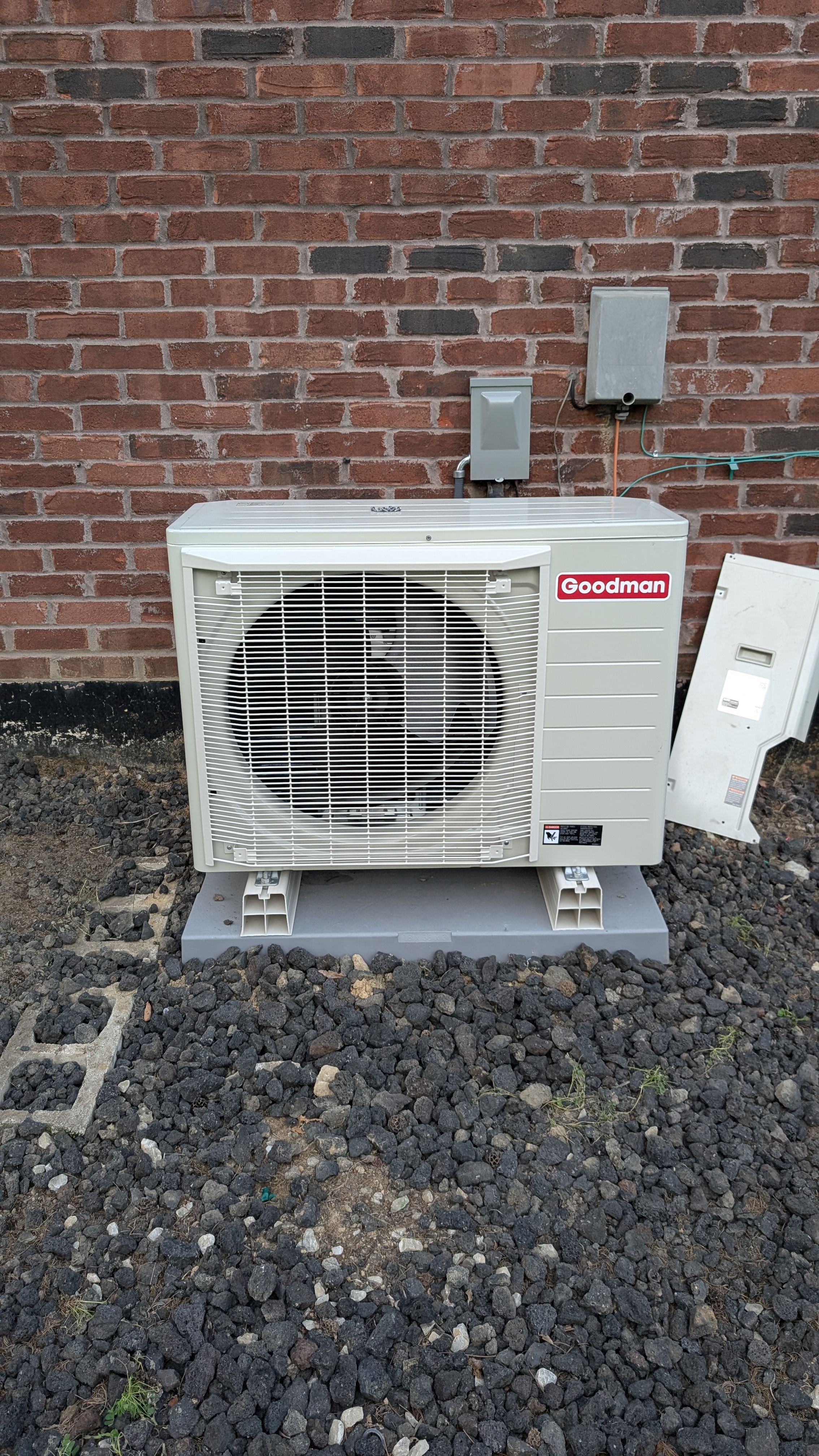 Completed Goodman mini-split outdoor condenser unit on pad Memphis Indiana installation