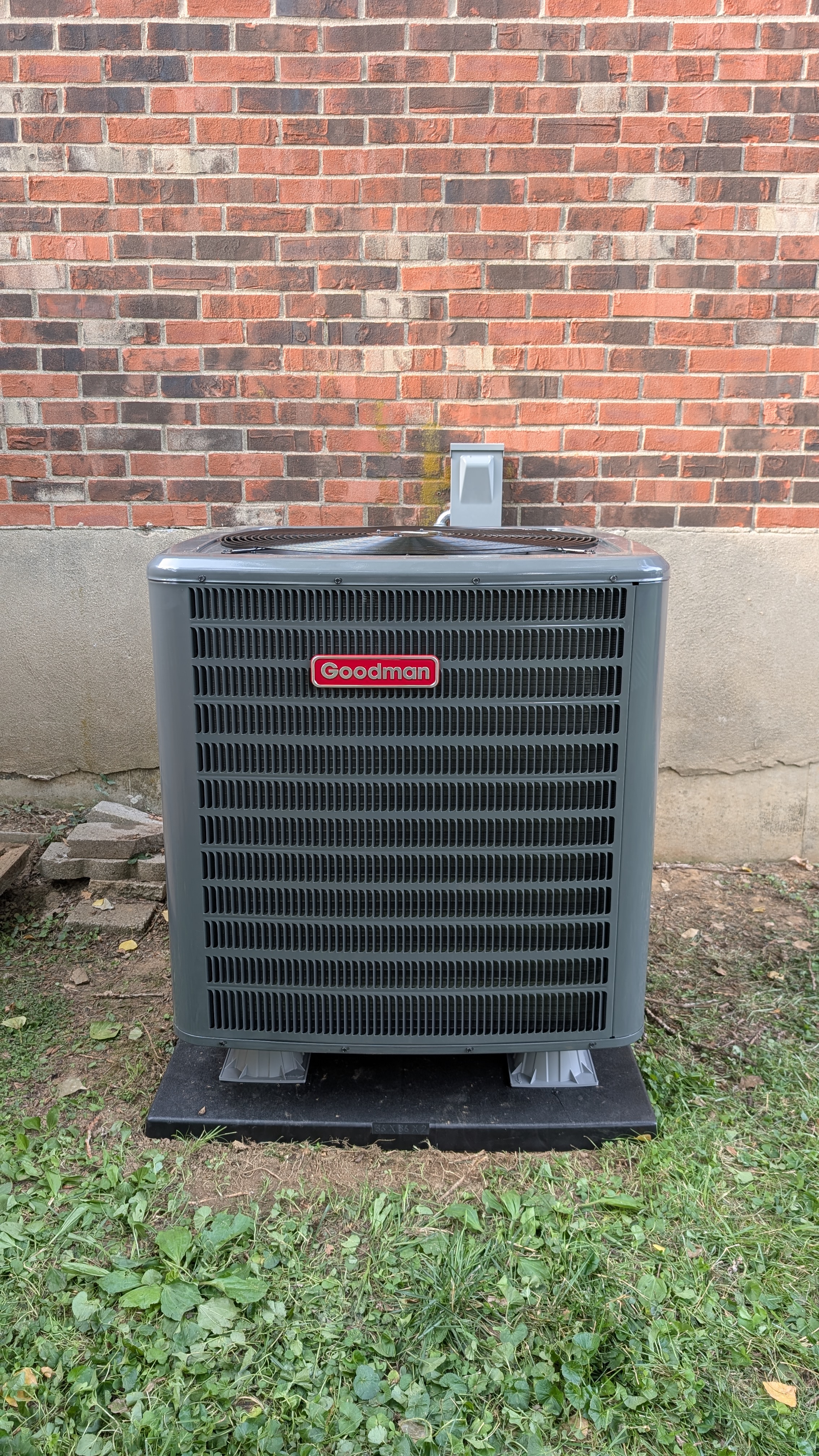 New Daikin condenser installed on pad with new disconnect box and line-set