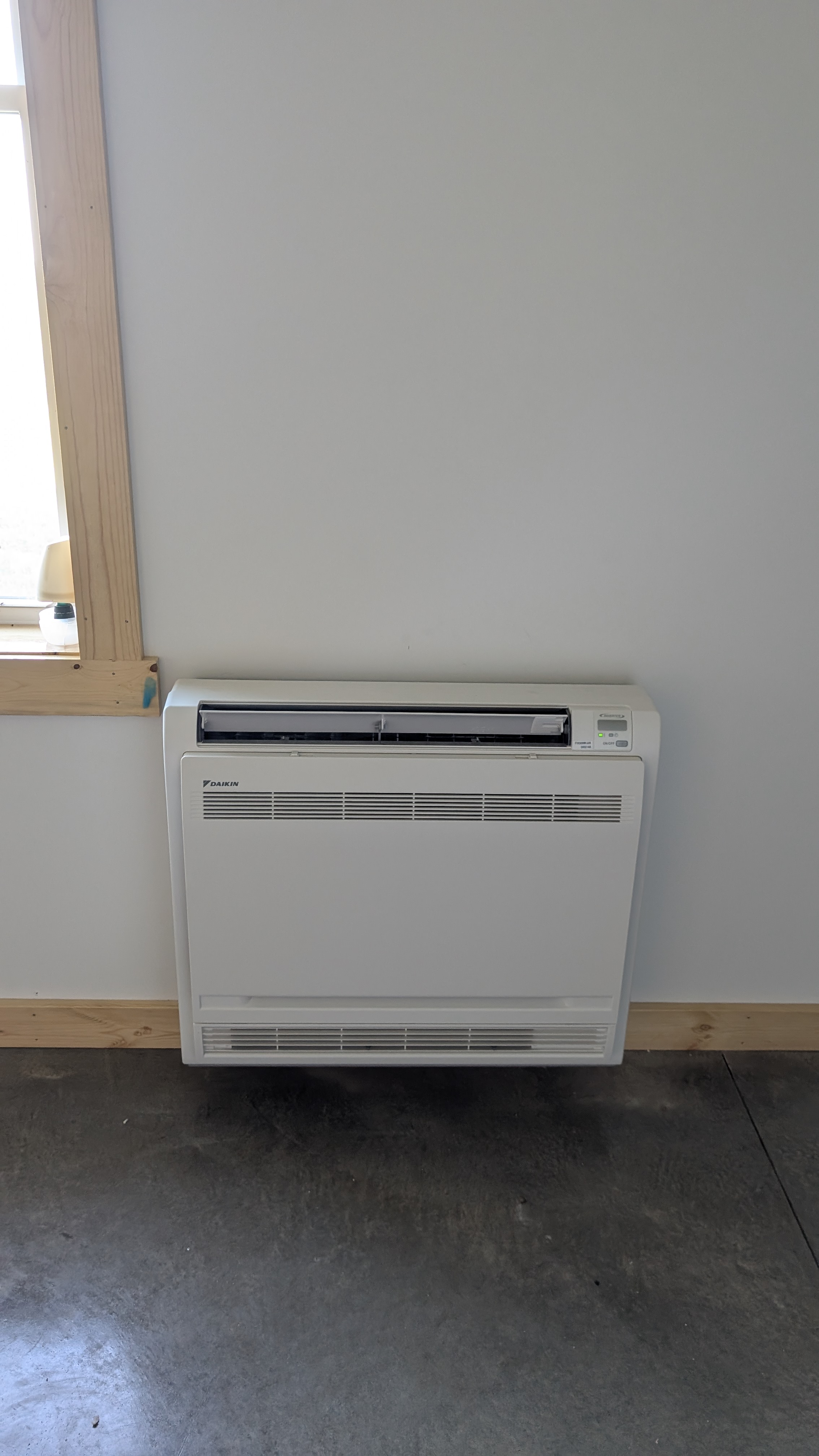 Daikin floor-console mini-split indoor unit close-up after installation in new Indiana building