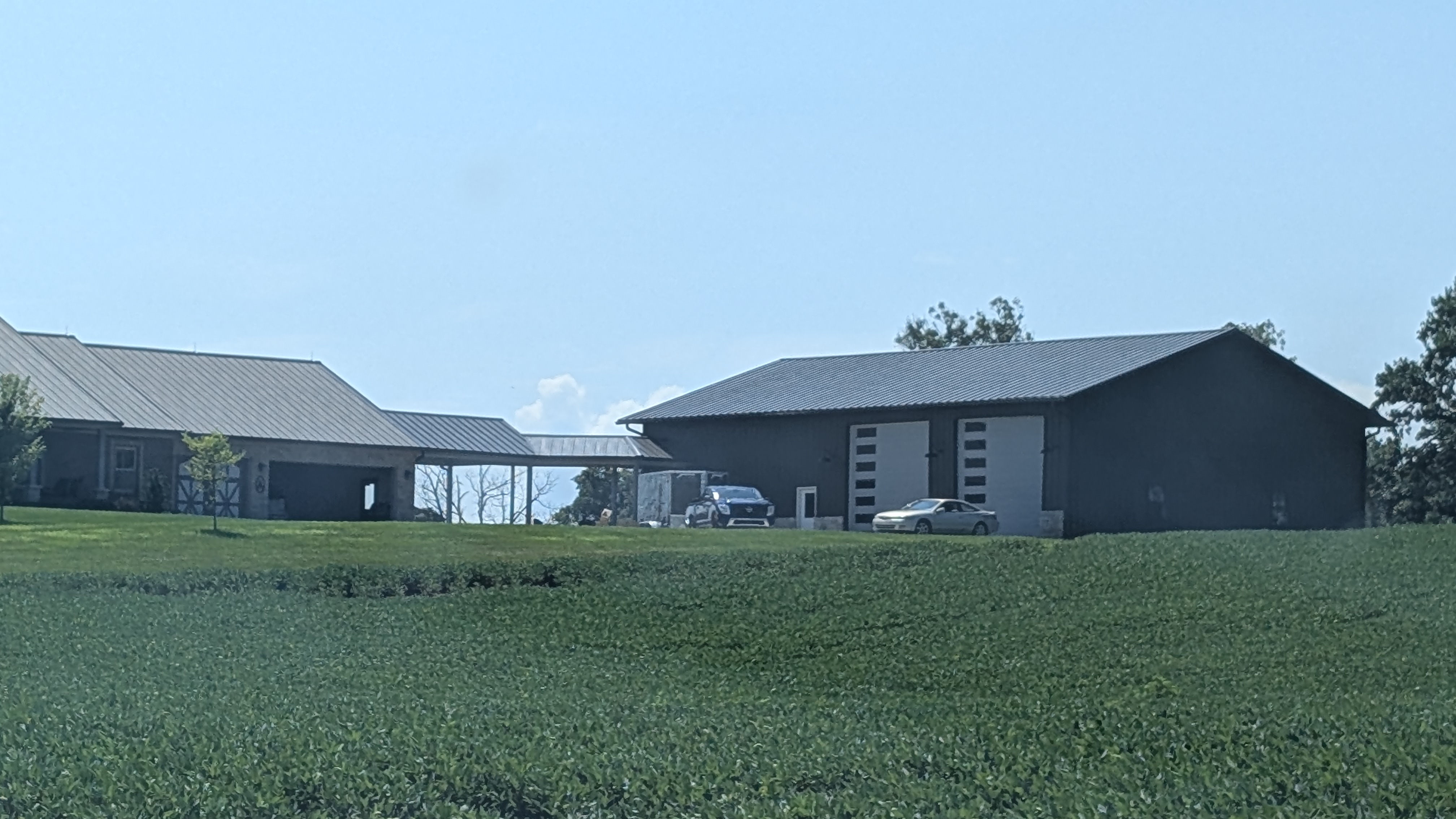 Dark metal pole barn building at Washington County Indiana mini-split installation job site