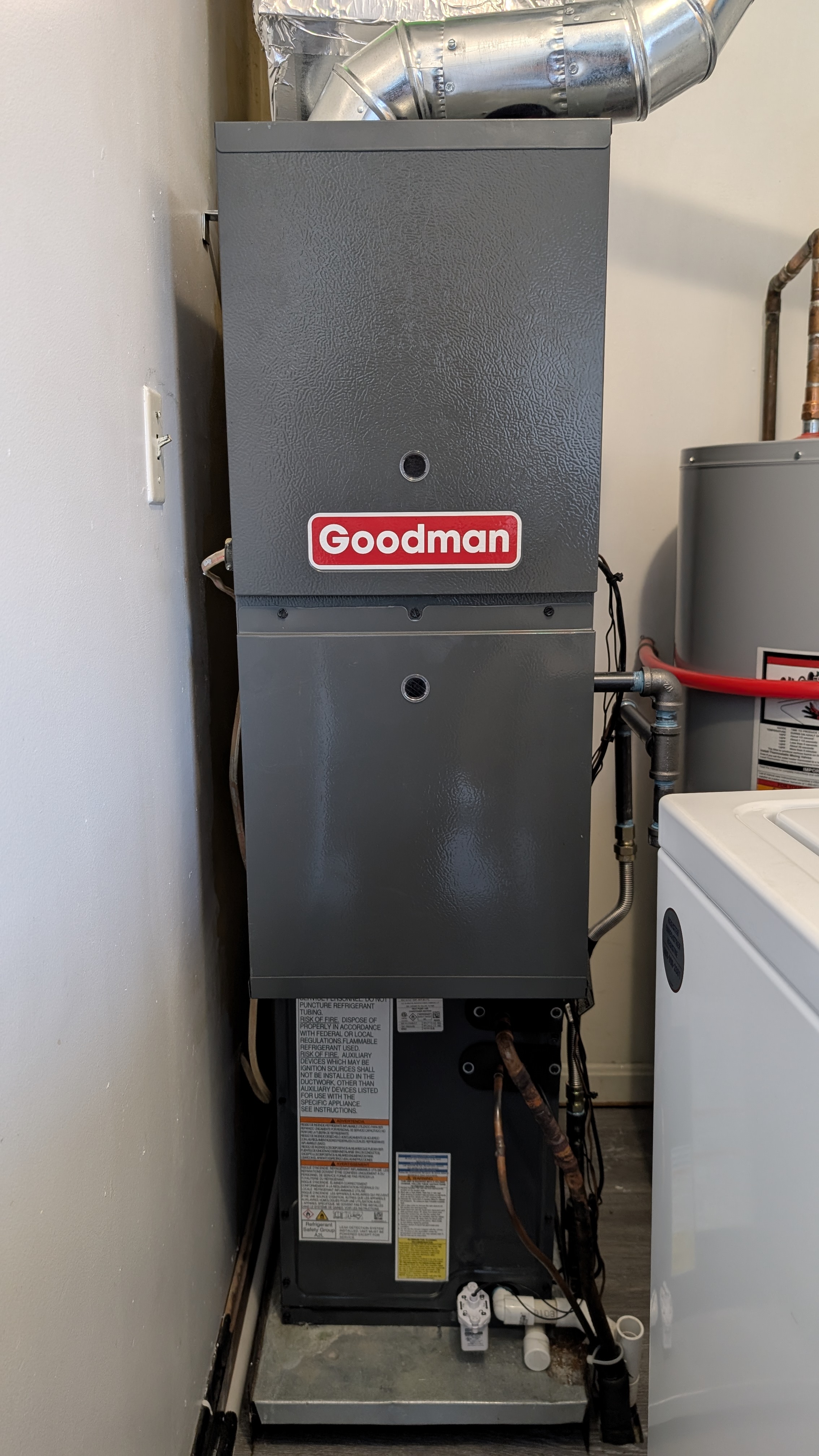 Goodman gas furnace clean front view installed residential HVAC